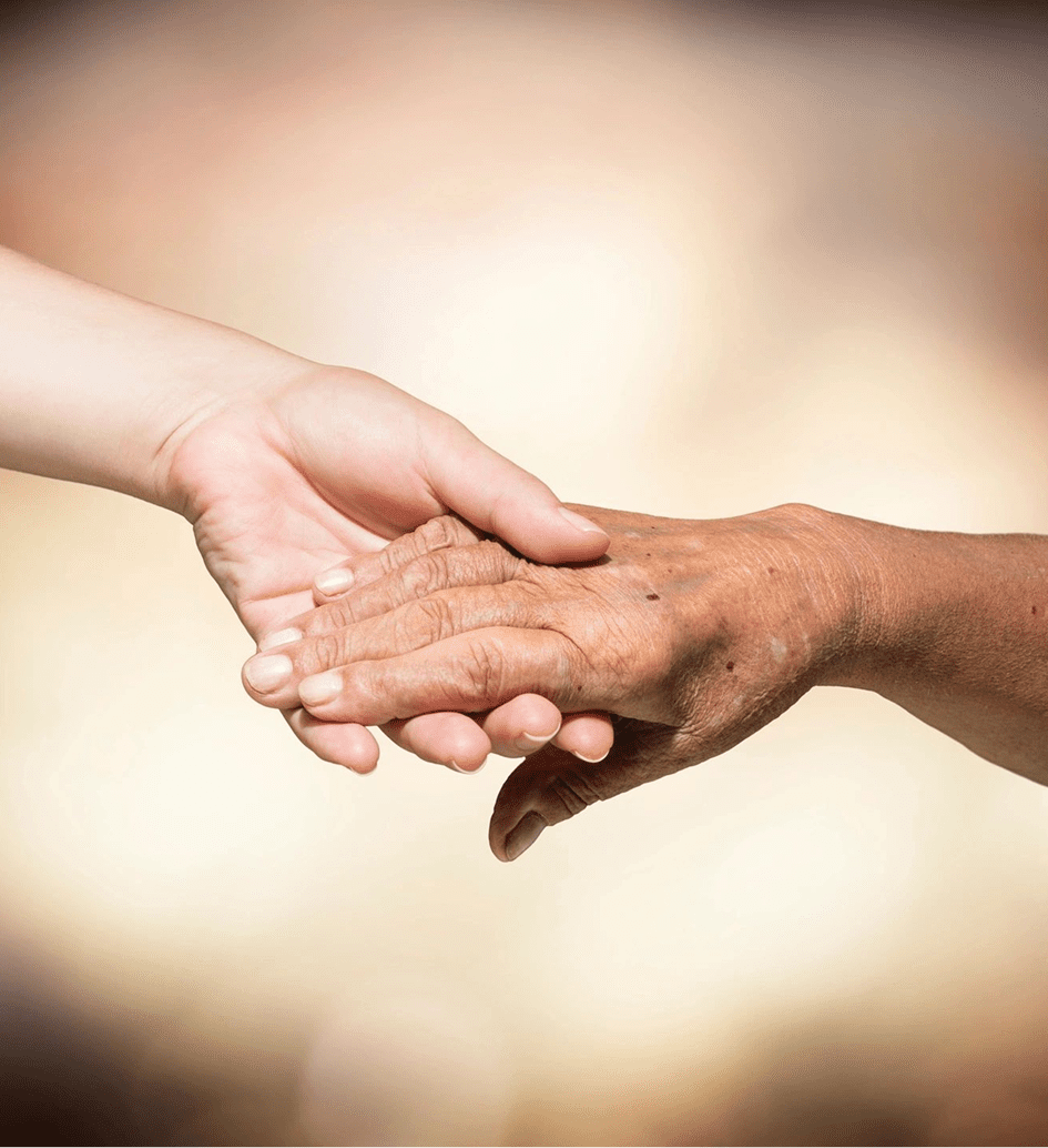 Two hands holding in gentle support.
